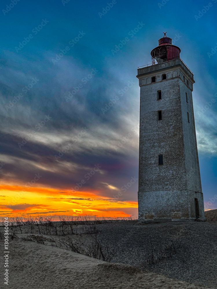 Sunset at the lighthouse Rubjerg Knude Fyr near Lokken in Denmark. Sunset at the lighthouse Rubjerg Knude Fyr near Lokken in Denmark.