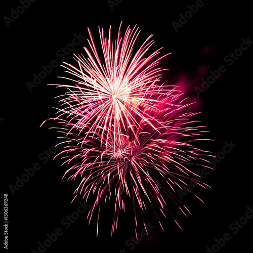 Colorful celebration fireworks isolated on black sky background.
