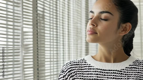 Young hispanic woman with closed eyes, reflecting in peaceful indoor setting