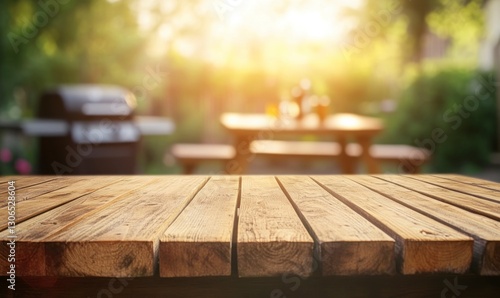 Wooden Table Surface with Barbecue Grill and Picnic Table in Background