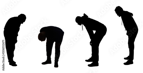 silhouette of a group of men looking at ground..