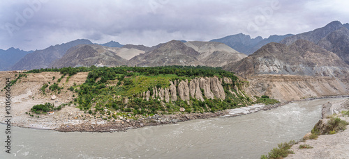 Scenic landscape panorama of Indus river valley and rock formations on overcast day near Chilas, Gilgit-Baltistan, Pakistan