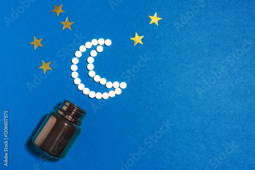 Melatonin tablets in shape of crescent moon photo