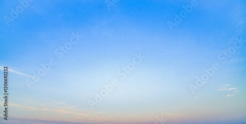 orange sky, fluffy white clouds, quiet, no one