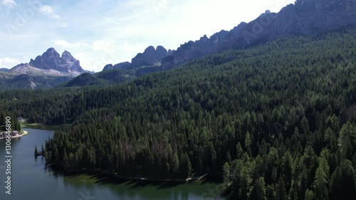 DRONE AERIAL FOOTAGE: Lake Misurina and the Tre Cime di Lavaredo (Three Peaks of Lavaredo) in the Sexten Dolomites of northeastern Italy. They are one of the best-known mountain groups in the Alps.