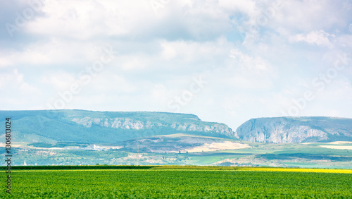 Obraz na płótnie beautiful countryside of romania. picturesque outskirts. sunny day. wonderful summer landscape in mountains. green field and rolling hills. rural scenery. cluj region w salonie