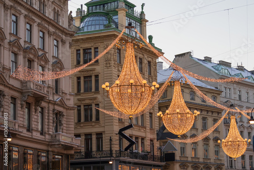 The famous beautiful chandeliers on Graben Street, sparkling festive Christmas city lights near Stephansdom and Stephansplatz in Vienna, Austria, winter evening walking tour, December 2023