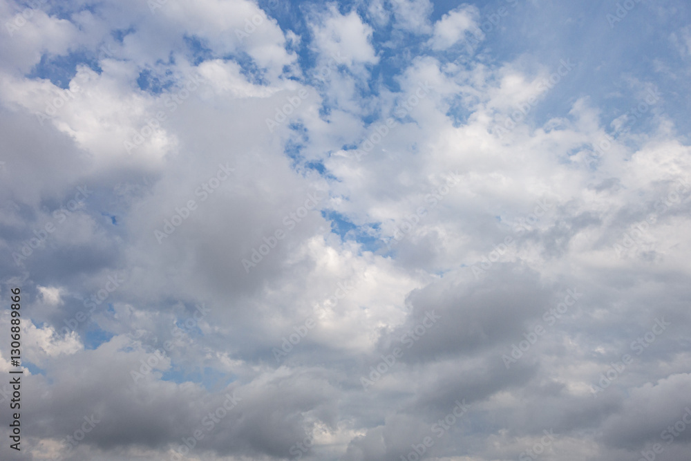 abstract background of white fluffy clouds on a bright blue sky abstract background of white fluffy clouds on a bright blue sky
