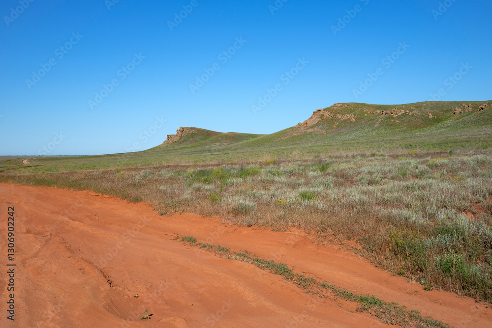 A fragment of a highway around Bolshoe Bogdo Mountain. Astrakhan region, Russia A fragment of a highway around Bolshoe Bogdo Mountain. Astrakhan region, Russia