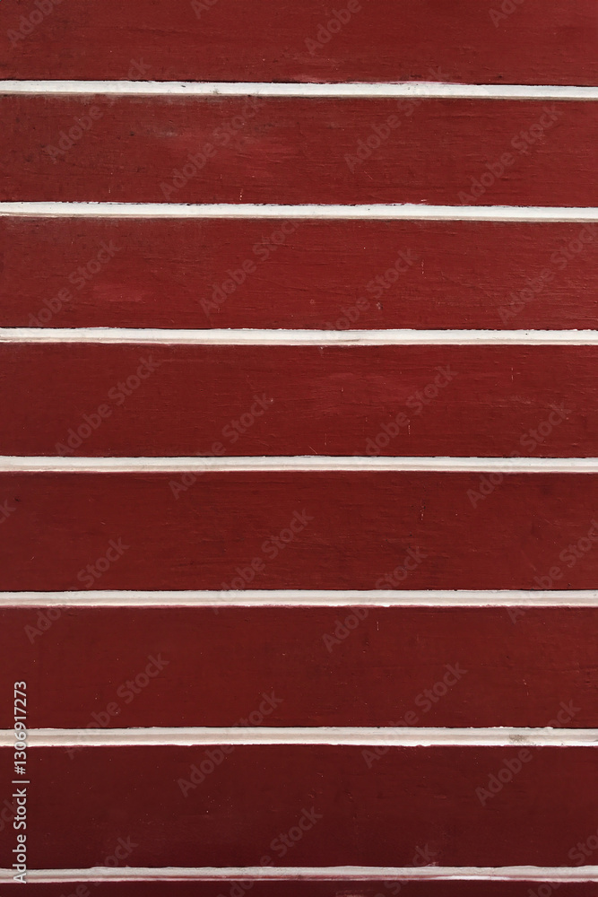 Fototapeta premium Deep red wall with white horizontal stripes