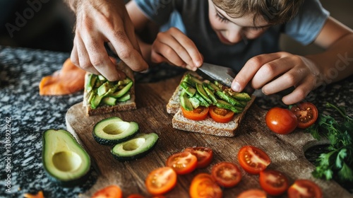 Avocado toast. Sliced avocado. Toast with tomatoes. Making food. Healthy meal. Food preparation. Lunch or snack. Boy preparing food. Simple snack. Open sandwich. Toast. Avocado. Tomatoes. photo