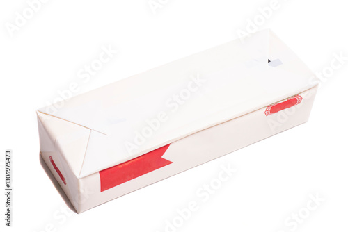 Stick of wrapped butter isolated on white background.