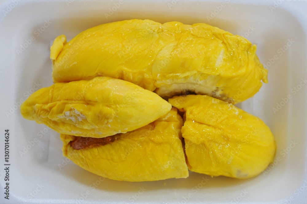 Fresh yllow durian fruit cut open in Singapore