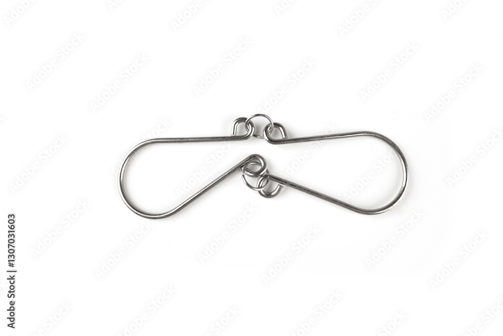 The Wire puzzle (Puzzle ring) on a white The Wire puzzle (Puzzle ring) on a white