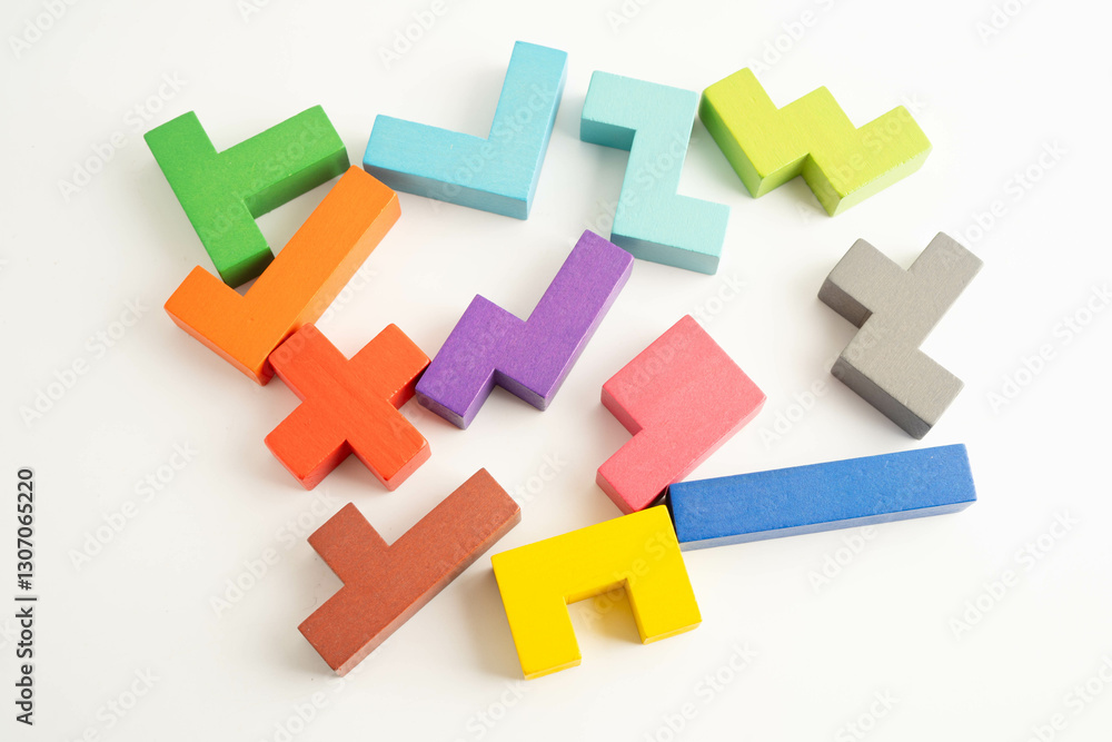 Obraz premium Logical thinking and problem solving problem solution creative business, wooden puzzle geometric block shape.