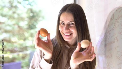 A happy girl dances and smiles while holding Easter eggs. Joy, spring vibes, and festive spirit in every move!