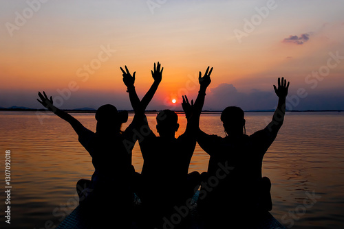 Bild auf Leinwand Rear view of three best friends travelers put hands up at sunset