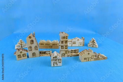 Hand carved soft spruce wood play houses decorated by burning. The houses were made by me.