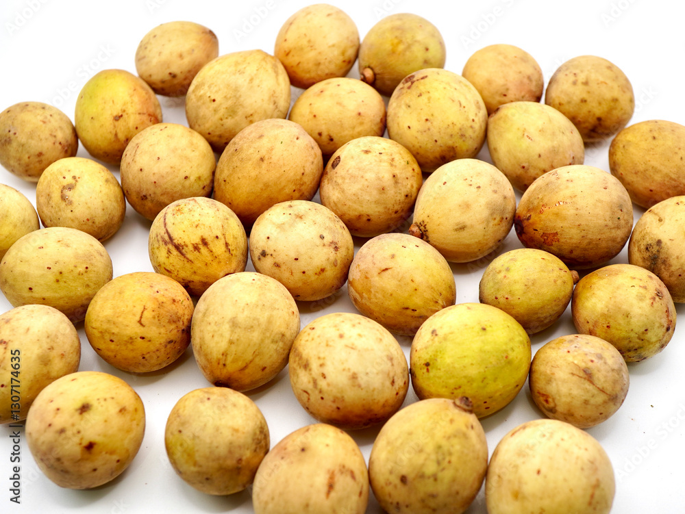 Close-up image of duku fruits or lansium parasiticum isolated on a clean white background Close-up image of duku fruits or lansium parasiticum isolated on a clean white background