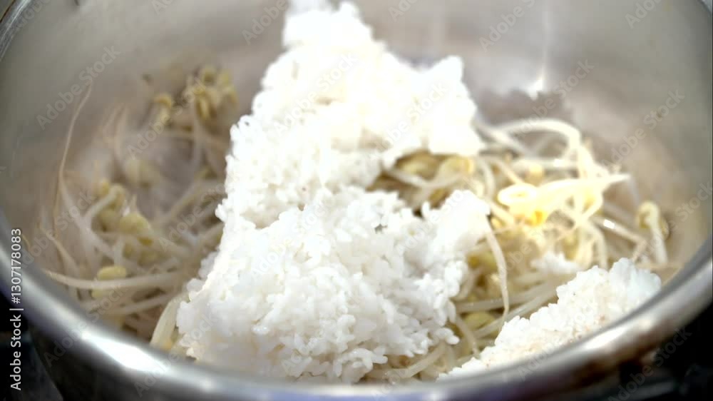 Mixing rice and bean sprouts in a pot Mixing rice and bean sprouts in a pot