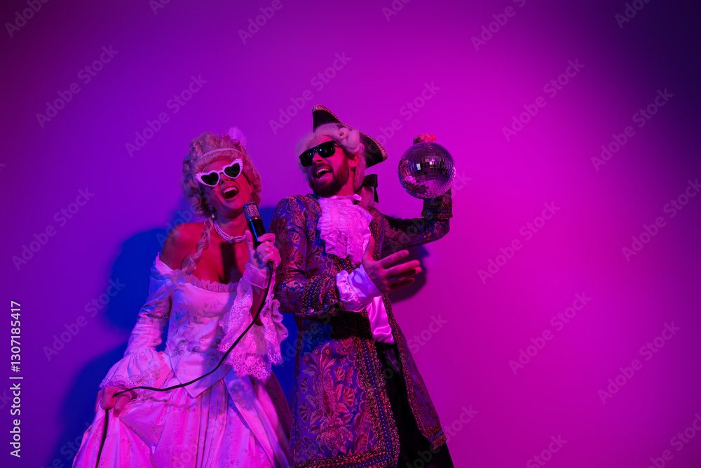 Fototapeta premium Two People in Vintage Costumes Dancing Under Neon Purple Light