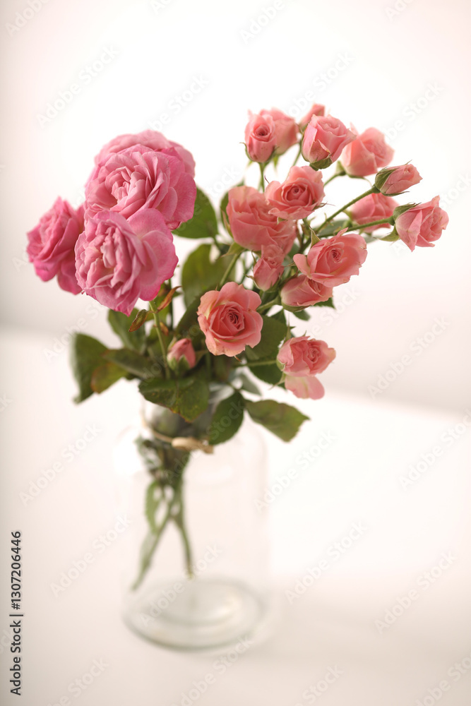 Beautiful bunch of fresh pink roses in full bloom against white background. Bouquet of flowers. Copy space for text. Valentine's day or Mother's day card. Beautiful bunch of fresh pink roses in full bloom against white background. Bouquet of flowers. Copy space for text. Valentine's day or Mother's day card.