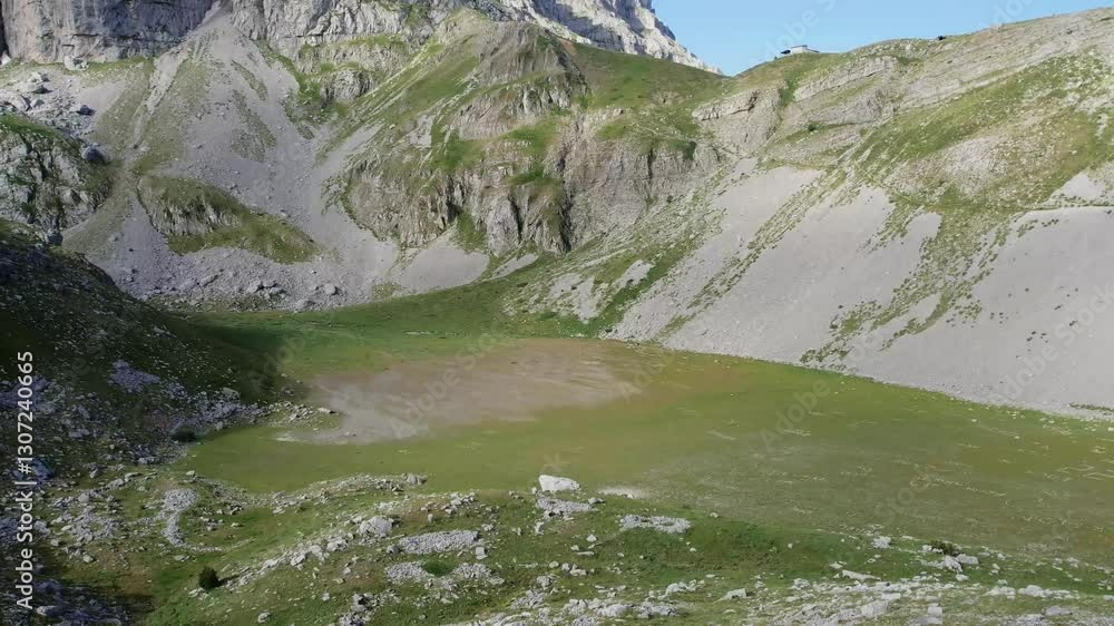 Stunning Green Plain and Rocky Mountains Ideal for Outdoor Activities Stunning Green Plain and Rocky Mountains Ideal for Outdoor Activities
