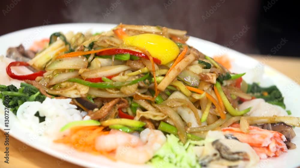 Starch sheet salad with mustard sauce topped with egg yolk Starch sheet salad with mustard sauce topped with egg yolk