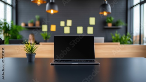 Modern Workspace with Laptop and Green Plants