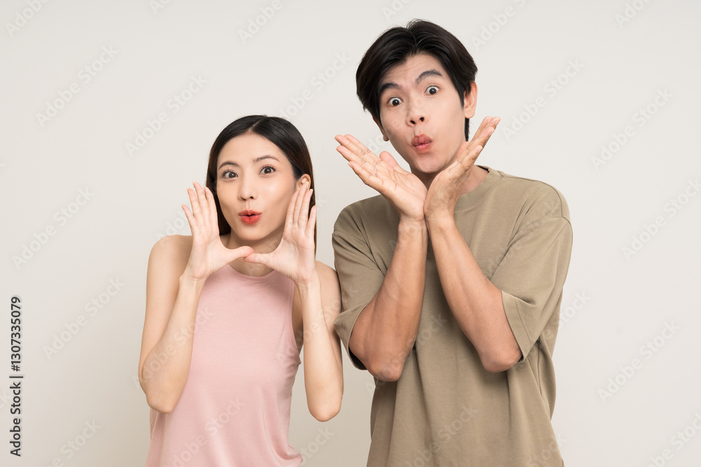 Hands open palm up Happy asian couple attractive in various action gesture standing on isolated white background. Cheerful Smiling young man and woman showing hands and wow excited Hands open palm up Happy asian couple attractive in various action gesture standing on isolated white background. Cheerful Smiling young man and woman showing hands and wow excited