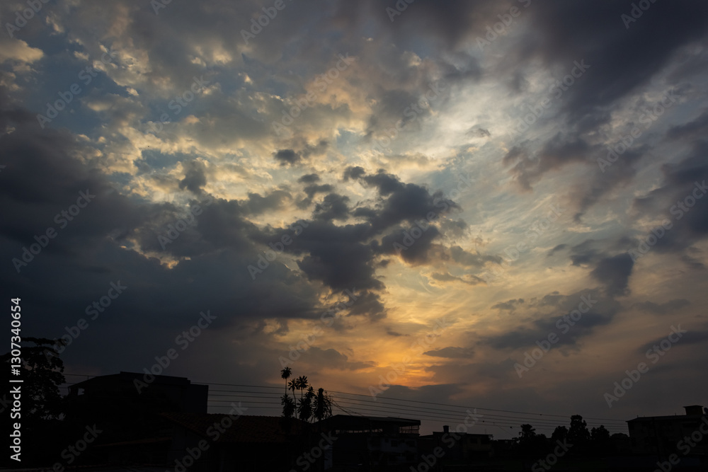 Sunset in the city, dramatic sky with clouds and sun. Sunset in the city, dramatic sky with clouds and sun.