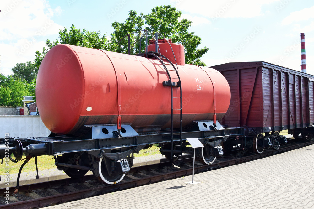 Naklejka premium A 25-ton railway tank coupled to an old wagon in a museum 