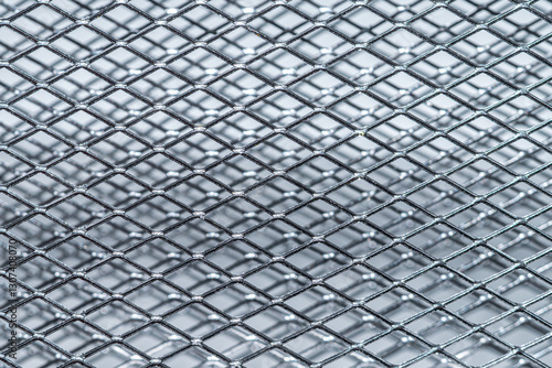 silver steel metal mesh. diagonal metallic chrome double grate, full frame background, close up photo