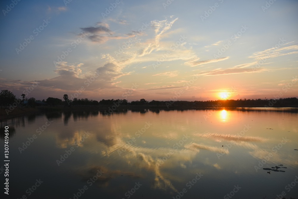 Fototapeta premium Orange sky with clouds at sunset