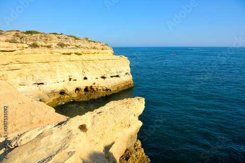 walking path with breathtaking views through the coast from porches to benagil caves lagoa algarve portugal