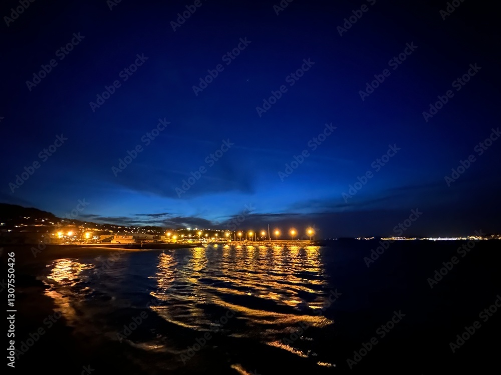 Blue hour view of the fishing village Bueu and the Atlantic Ocean, Galicia, Spain, April 2024