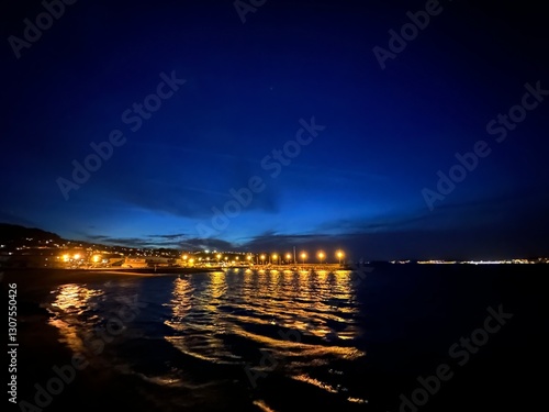 Obraz na płótnie Blue hour view of the fishing village Bueu and the Atlantic Ocean, Galicia, Spain, April 2024 w salonie