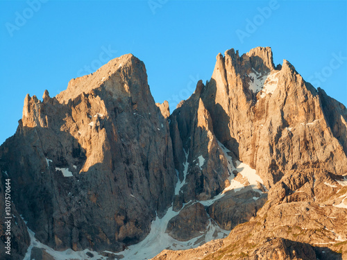 Aerial view beautiful Dolomite mountain Alps dawn range against blue sky on sunny day Italy. Top view drone of high rocks, mountain peaks. Tourism travel concept. Amazing nature scenery in Dolomites
