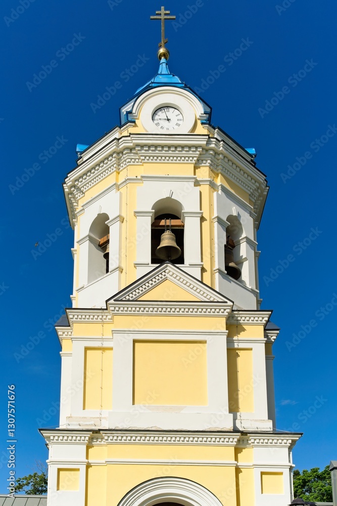 Konevets Island, Russia, July 13, 2024. Cathedral bell tower with a clock. Konevets Island, Russia, July 13, 2024. Cathedral bell tower with a clock.