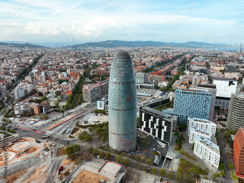 Facade tall metal tower residential buildings city blocks boulevards with green trees in summer on sunny day sunrise on lens flares. Go Everywhere 