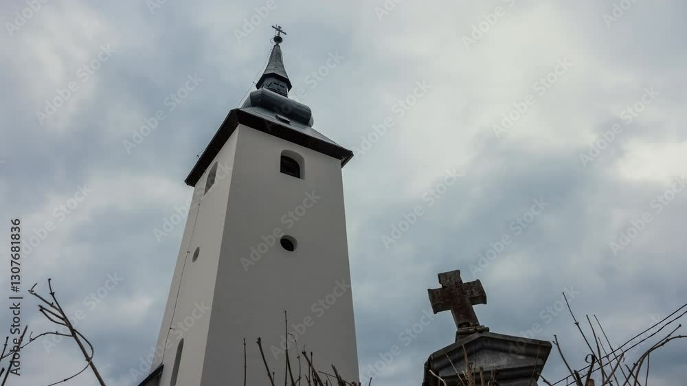 Under a vast expanse of textured clouds, a humble chapel stands as a beacon of faith Under a vast expanse of textured clouds, a humble chapel stands as a beacon of faith