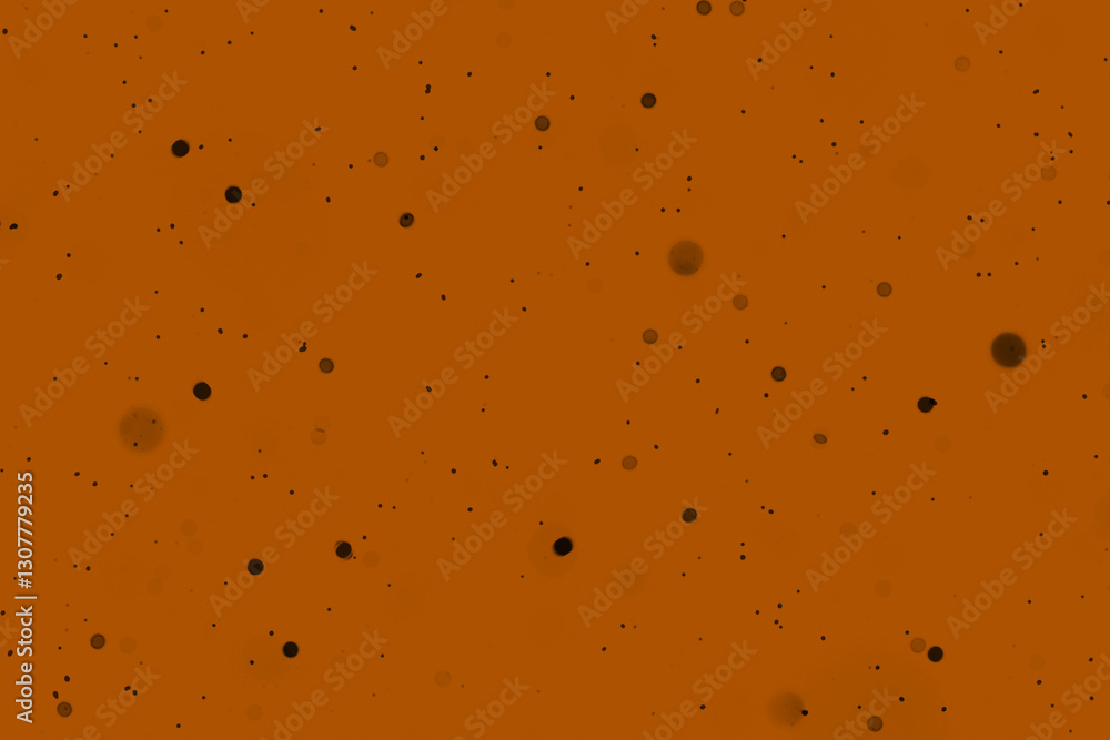 Abstract background showing dots against a textured orange foundation Abstract background showing dots against a textured orange foundation