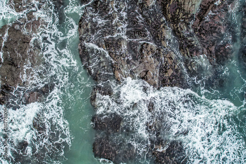 Aerial, Winter’s crashing tidal waves at Down Derry in Cornwall UK