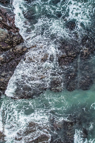 Aerial, Winter’s crashing tidal waves at Down Derry in Cornwall UK