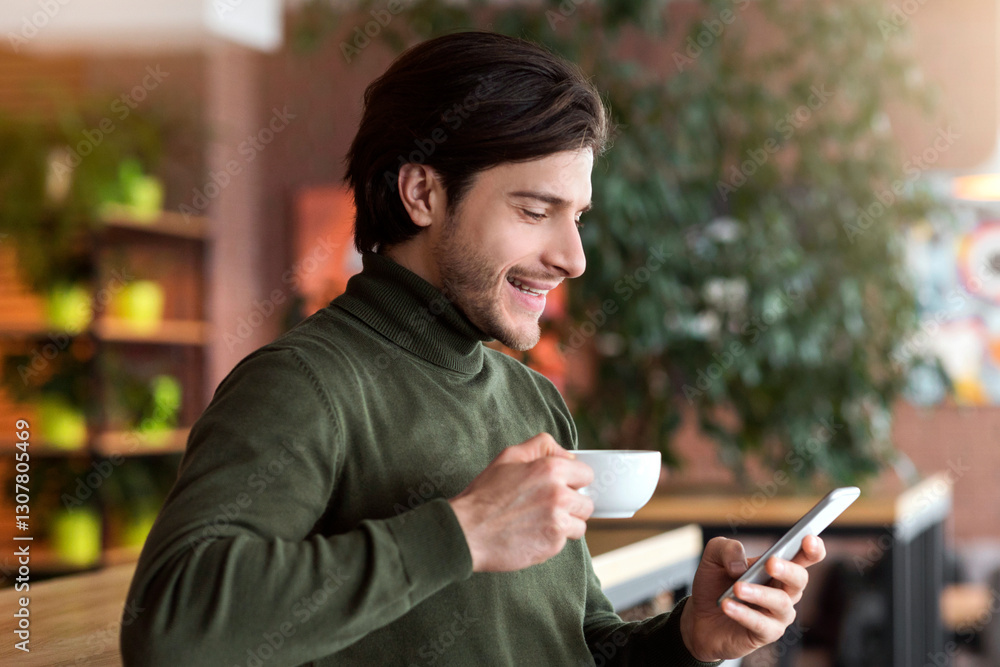 Prosperous young businessman having coffee break at cafe, using smartphone, copy space Prosperous young businessman having coffee break at cafe, using smartphone, copy space