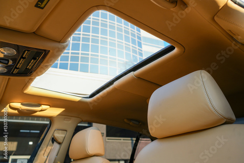 Konstfotografi A car interior with a sunroof and two seats
