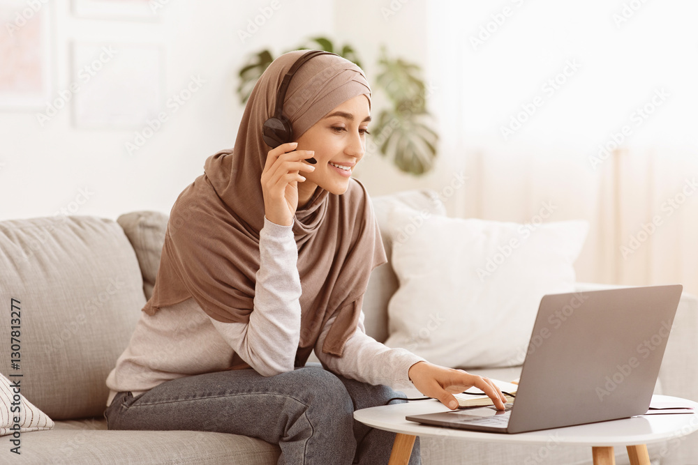 Online Education. Young Arabic Woman In Hijab And With Headset Study On Laptop At Home, Learning Foreign Languages, Copy Space Online Education. Young Arabic Woman In Hijab And With Headset Study On Laptop At Home, Learning Foreign Languages, Copy Space
