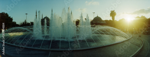 Panoramic view of fountain by the Blue Mosque in Istanbul, Turkey. photo