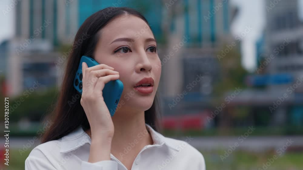 Lost Woman Solves Problems On The Phone While Standing On The Street. Beautiful Serious Busy Businesswoman Outside Talking On The Phone With Staff. People and Technology Concept Lost Woman Solves Problems On The Phone While Standing On The Street. Beautiful Serious Busy Businesswoman Outside Talking On The Phone With Staff. People and Technology Concept