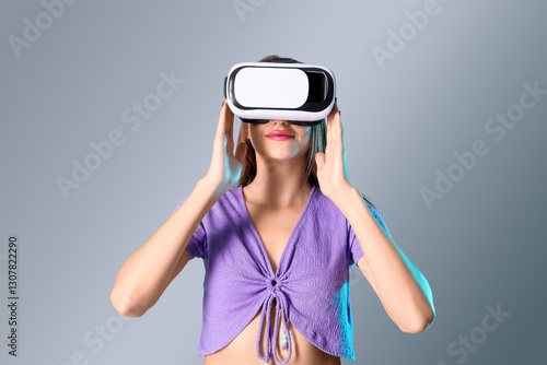Young woman using VR glasse...